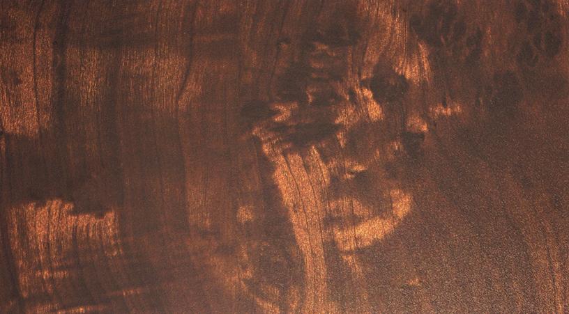Brown wood laminate with textured finish and wood grain pattern, showing natural variations and texture details.