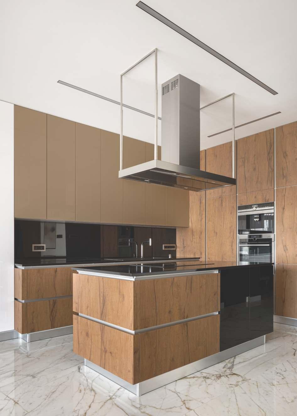 Brown wood laminate kitchen cabinets with textured wood grain finish and silver handles on marble floor in modern kitchen