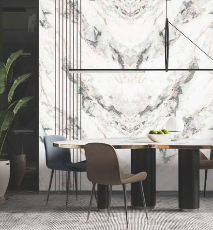 White marble laminate wall with gray and gold veining texture in a modern dining room with minimalist furniture