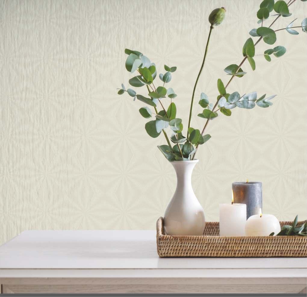 White textured laminate wall with subtle pattern behind a table with decorative vase and candles in a wicker tray