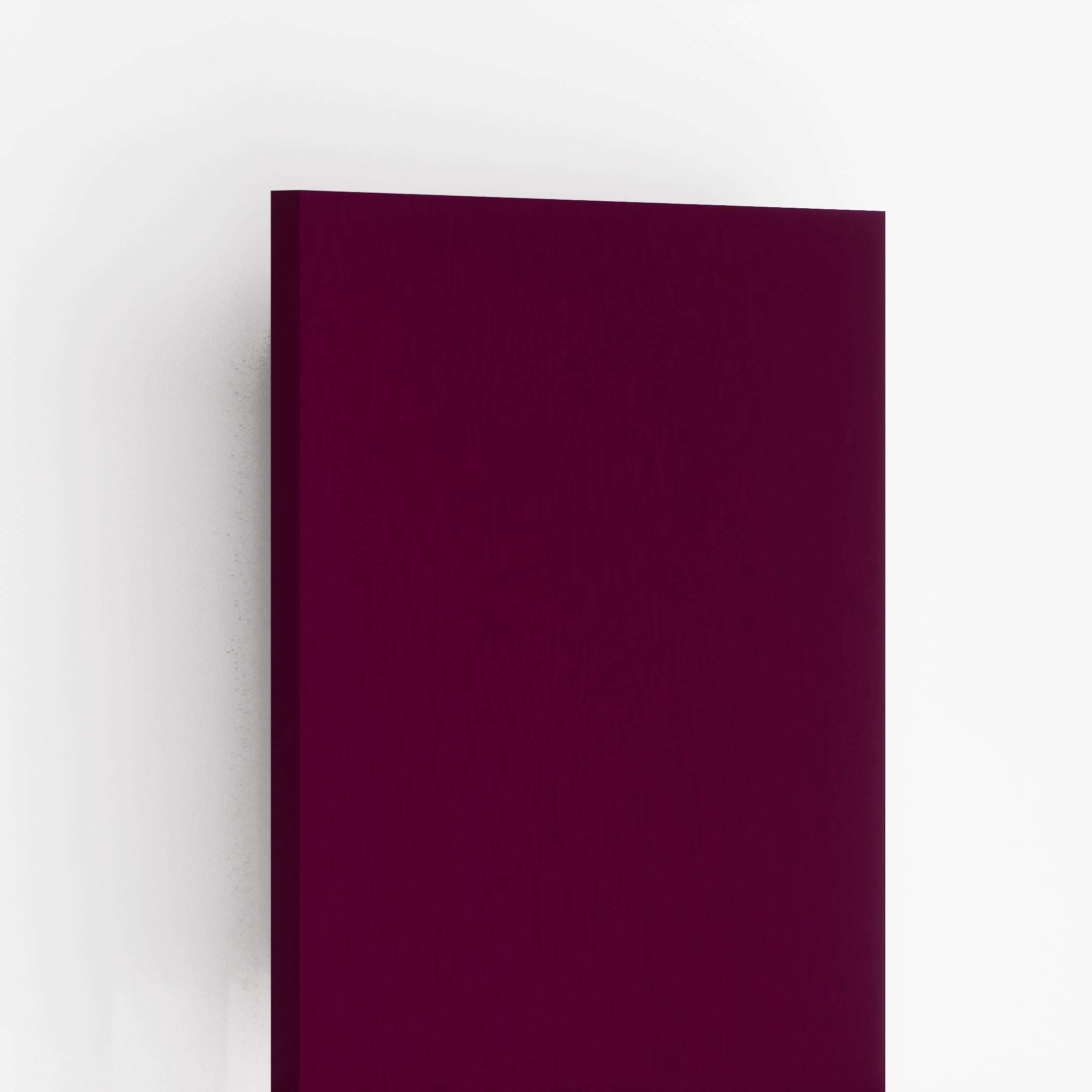 Pink suede laminate sheet with plain color and matte finish, showing edge detail and subtle texture on its surface.