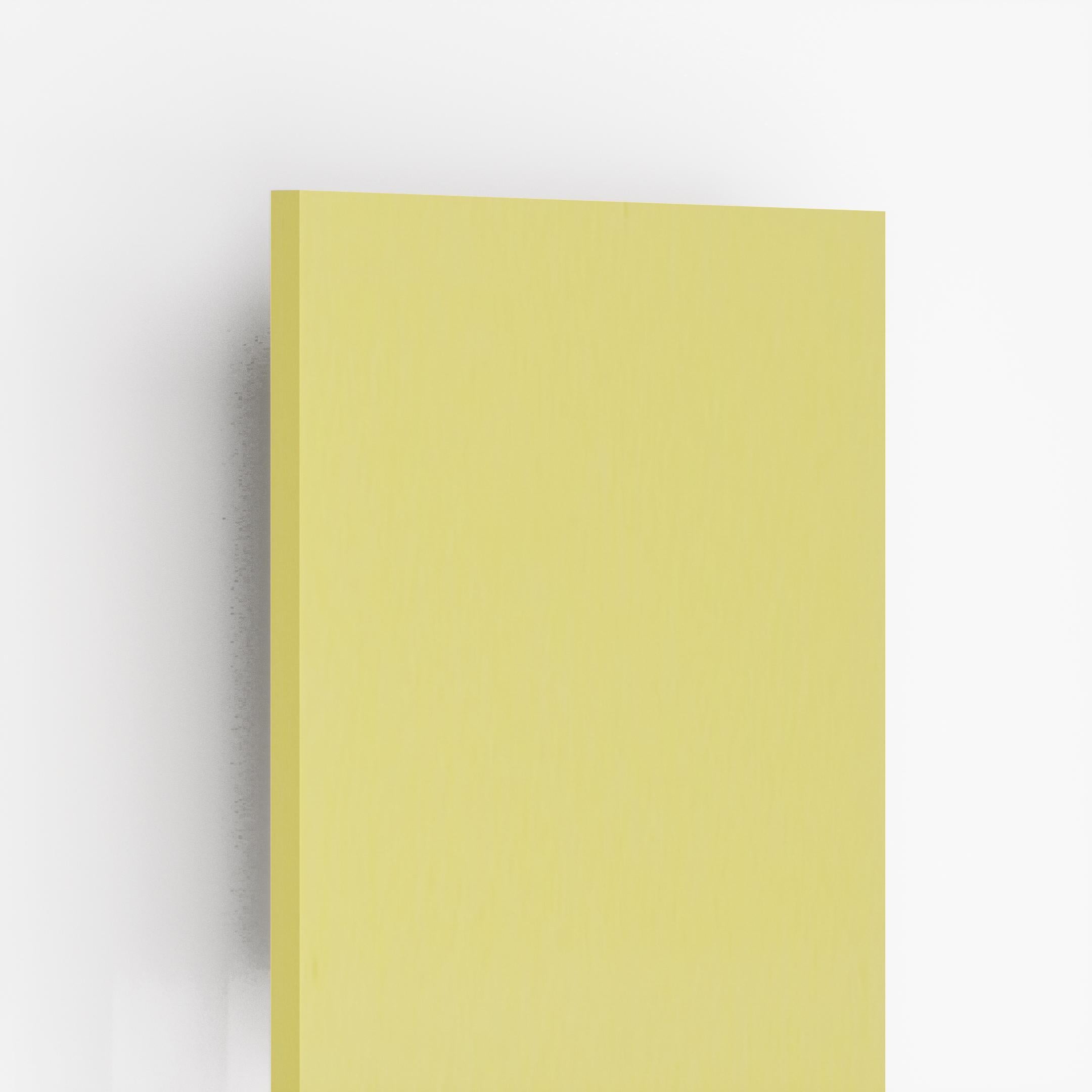 Yellow plain laminate with suede finish and visible edge, showcasing thickness and flat surface texture.