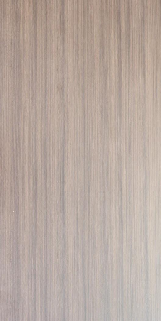 Brown wood laminate with suede finish and vertical wood grain pattern, showing subtle texture and muted sheen.