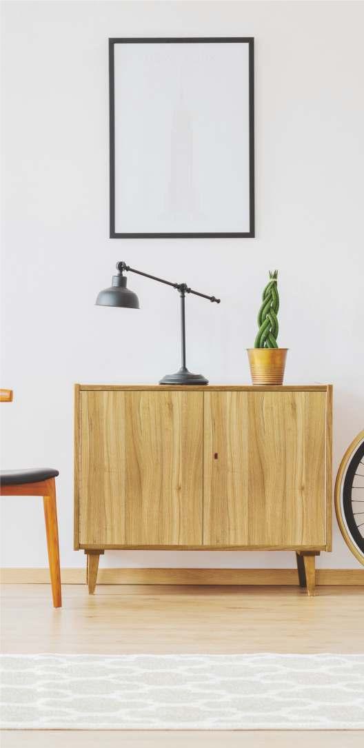 Brown wood grain laminate cabinet with textured finish in a modern room setting with decorative lamp and potted plant.