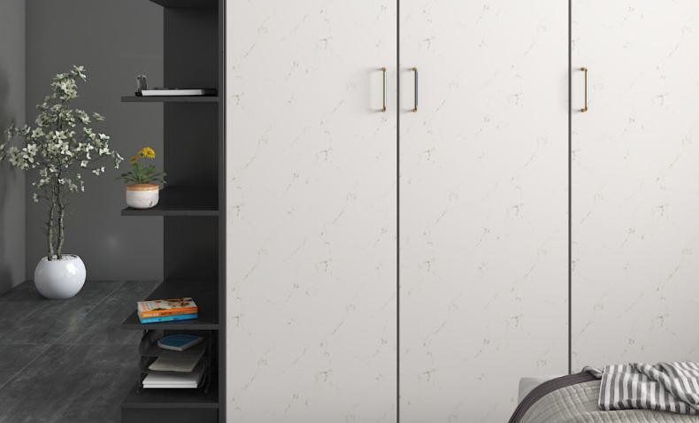 White marble laminate wardrobe with glossy finish and subtle veining, used in modern bedroom with dark shelving unit and