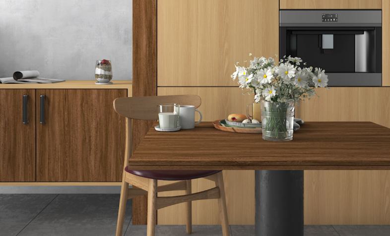 Brown wood laminate kitchen furniture with textured finish and wood grain pattern on table and cabinets.