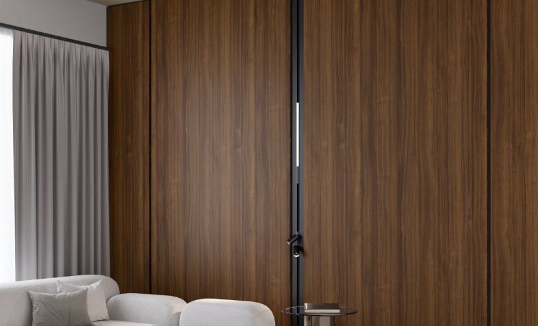 Brown wood grain laminate wall with textured finish in a modern living room setting with white furniture