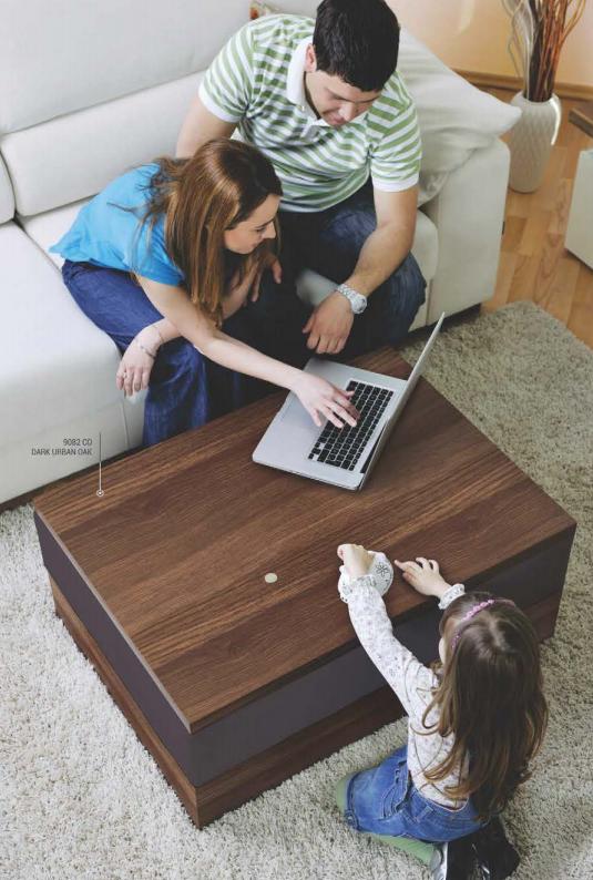 Dark wood grain laminate coffee table with textured finish, used in a living room setting with family.