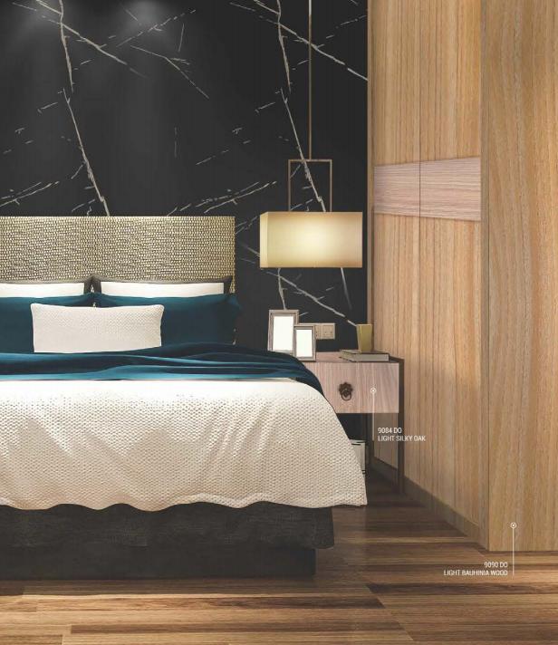 Brown wood grain laminate texture on bedroom floor and wall, showing wood pattern and texture details.