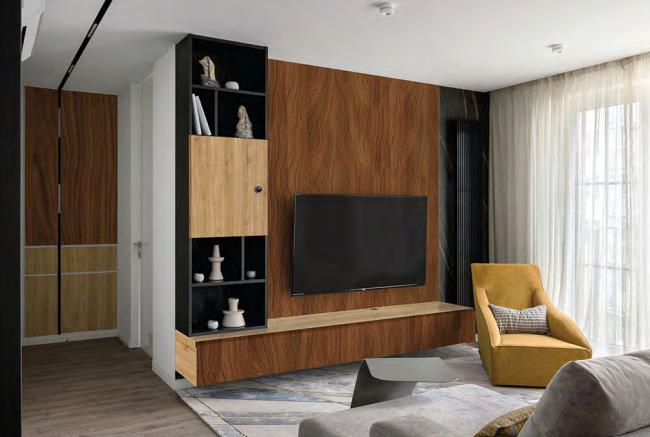 Brown wood grain laminate wall with textured finish in modern living room with yellow chair and TV installation