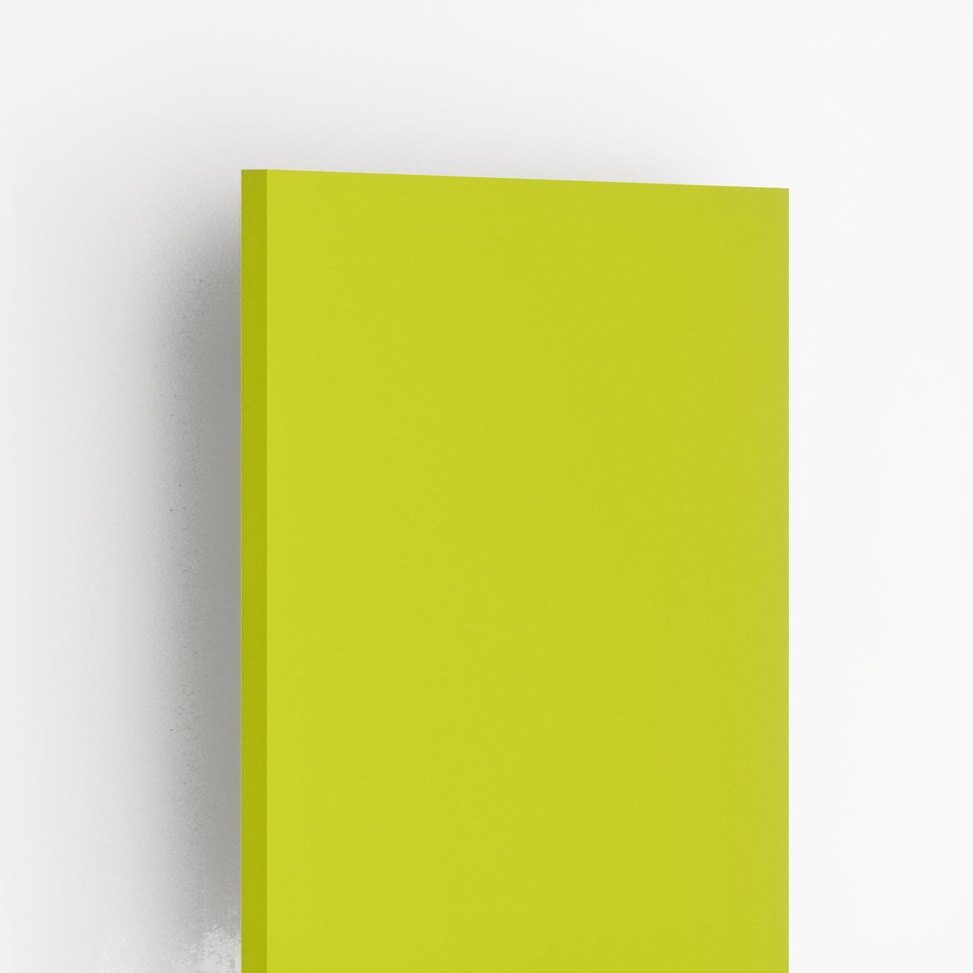 Glossy green plain laminate sheet with smooth finish and visible edge against white background