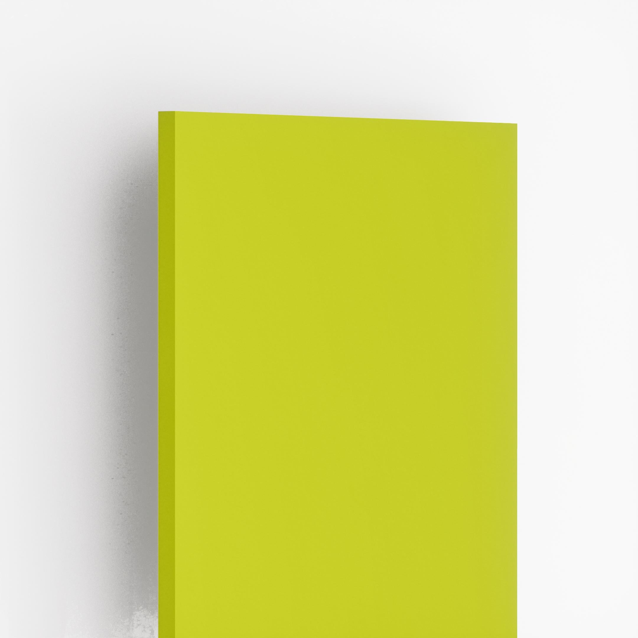 Glossy green plain laminate sheet with smooth finish and visible edge against white background