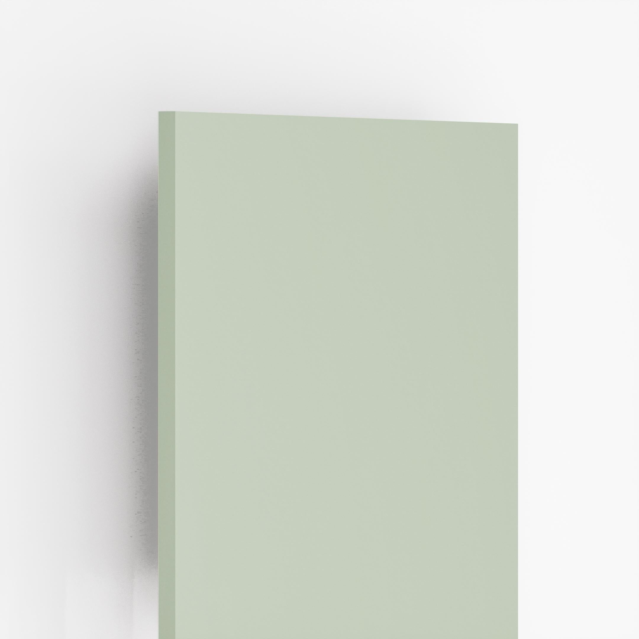 Plain green suede laminate sheet with matte finish and smooth texture, showing edge detail and subtle shadow effect