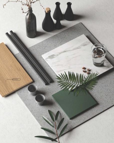 Brown wood grain laminate with suede finish and visible texture, displayed with decorative items on a gray surface