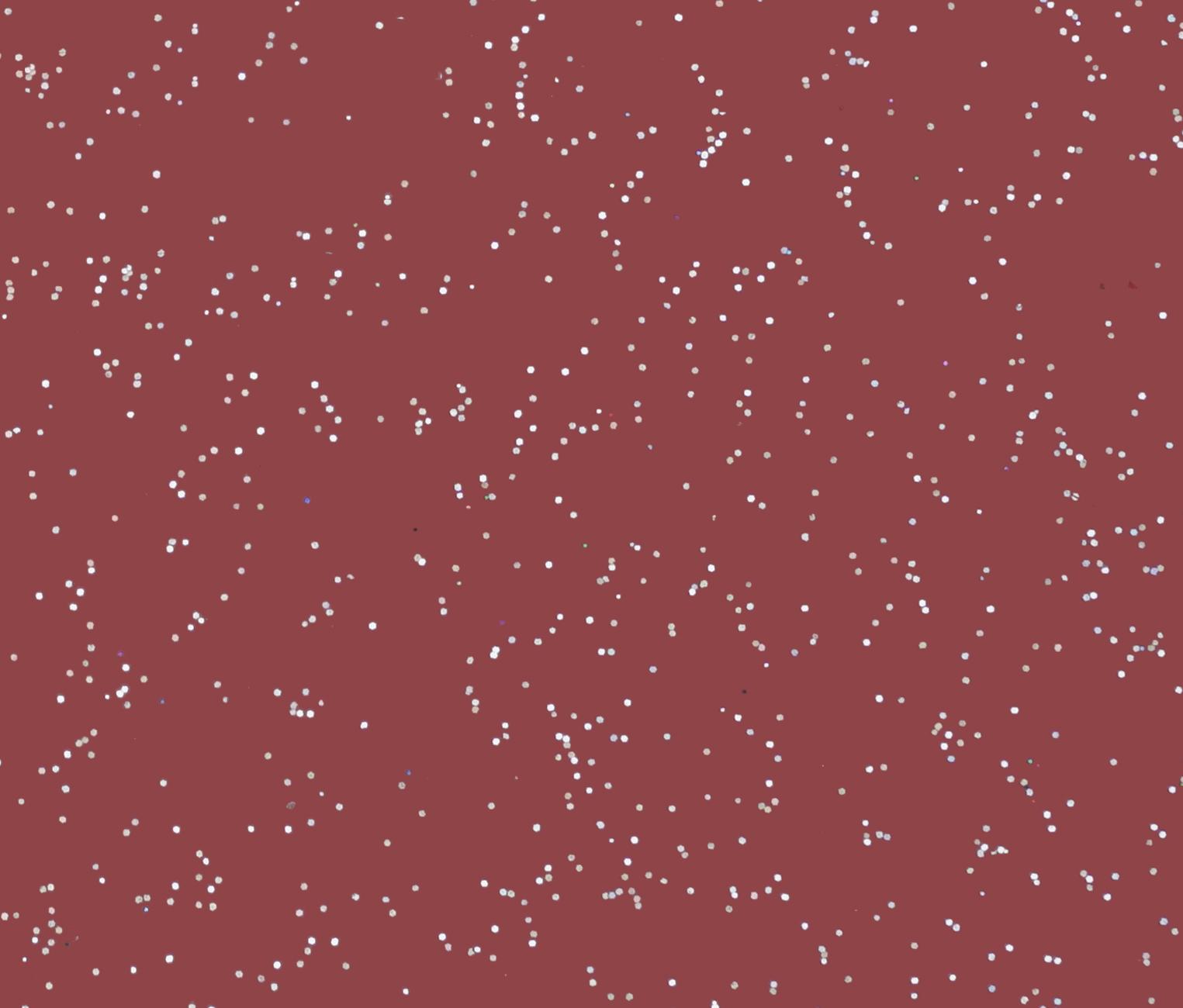 Red decorative laminate with white speckles and textured finish
