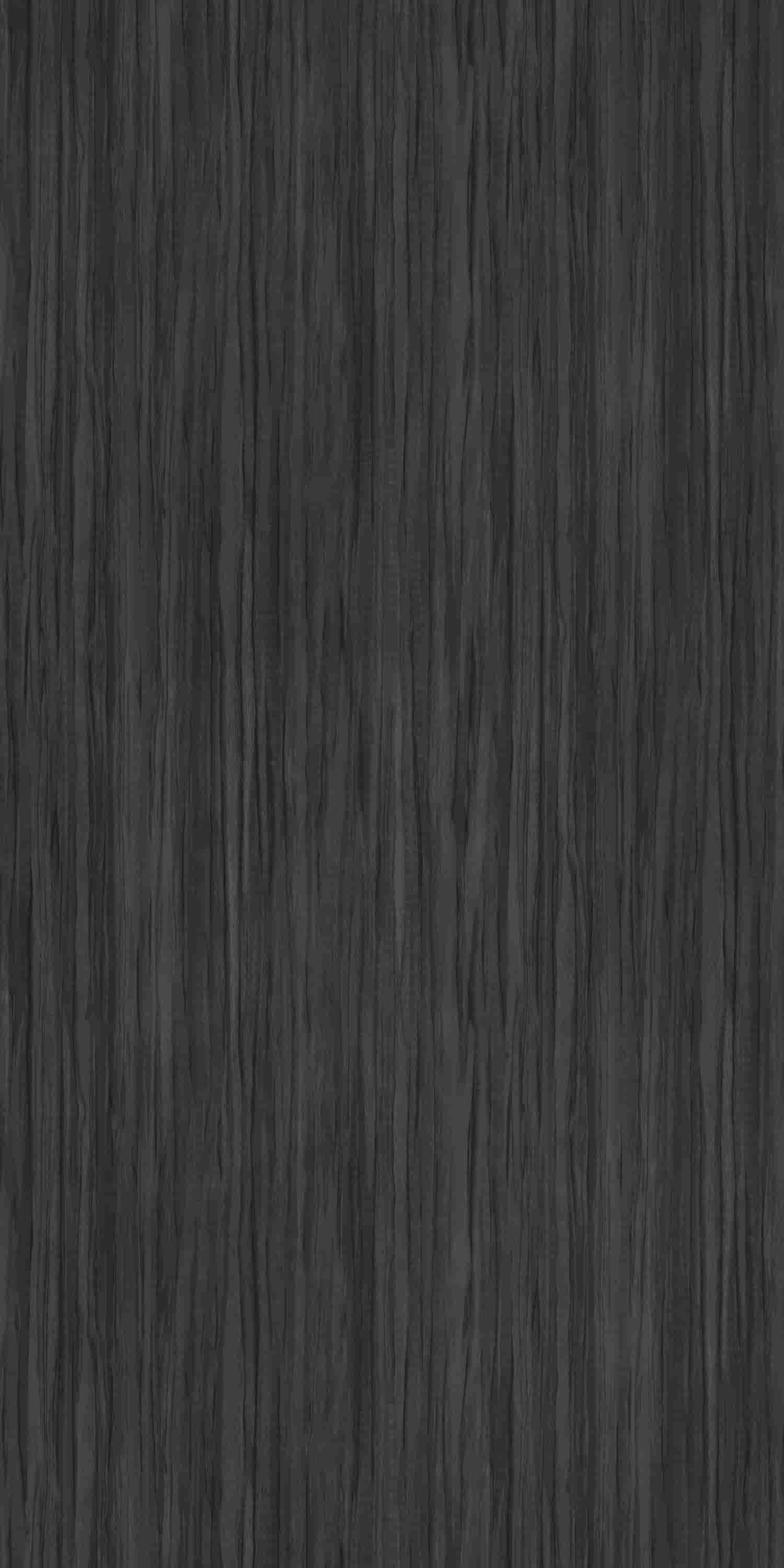 Black wood laminate with suede finish and wood grain texture, showing vertical lines and subtle sheen, decorative laminate