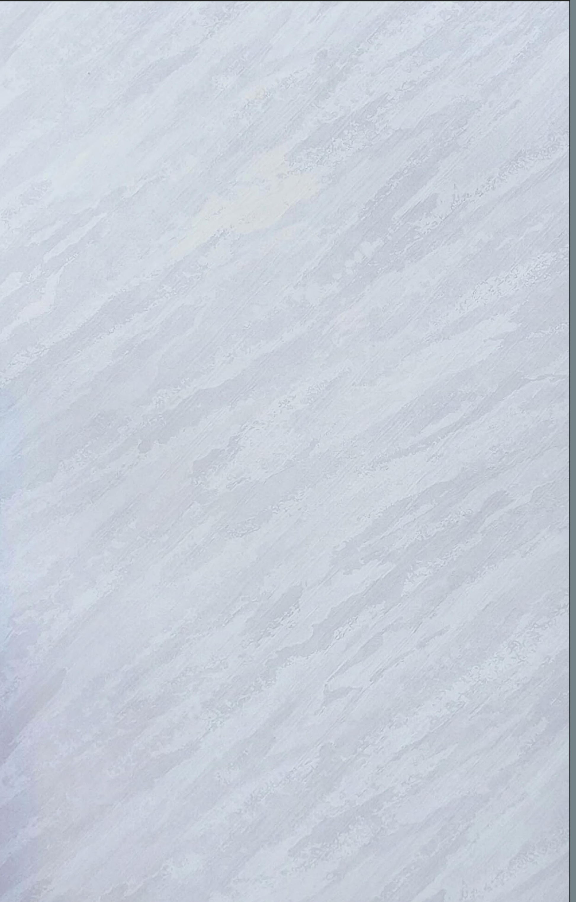 White glossy marble laminate with diagonal streaks and textured surface.