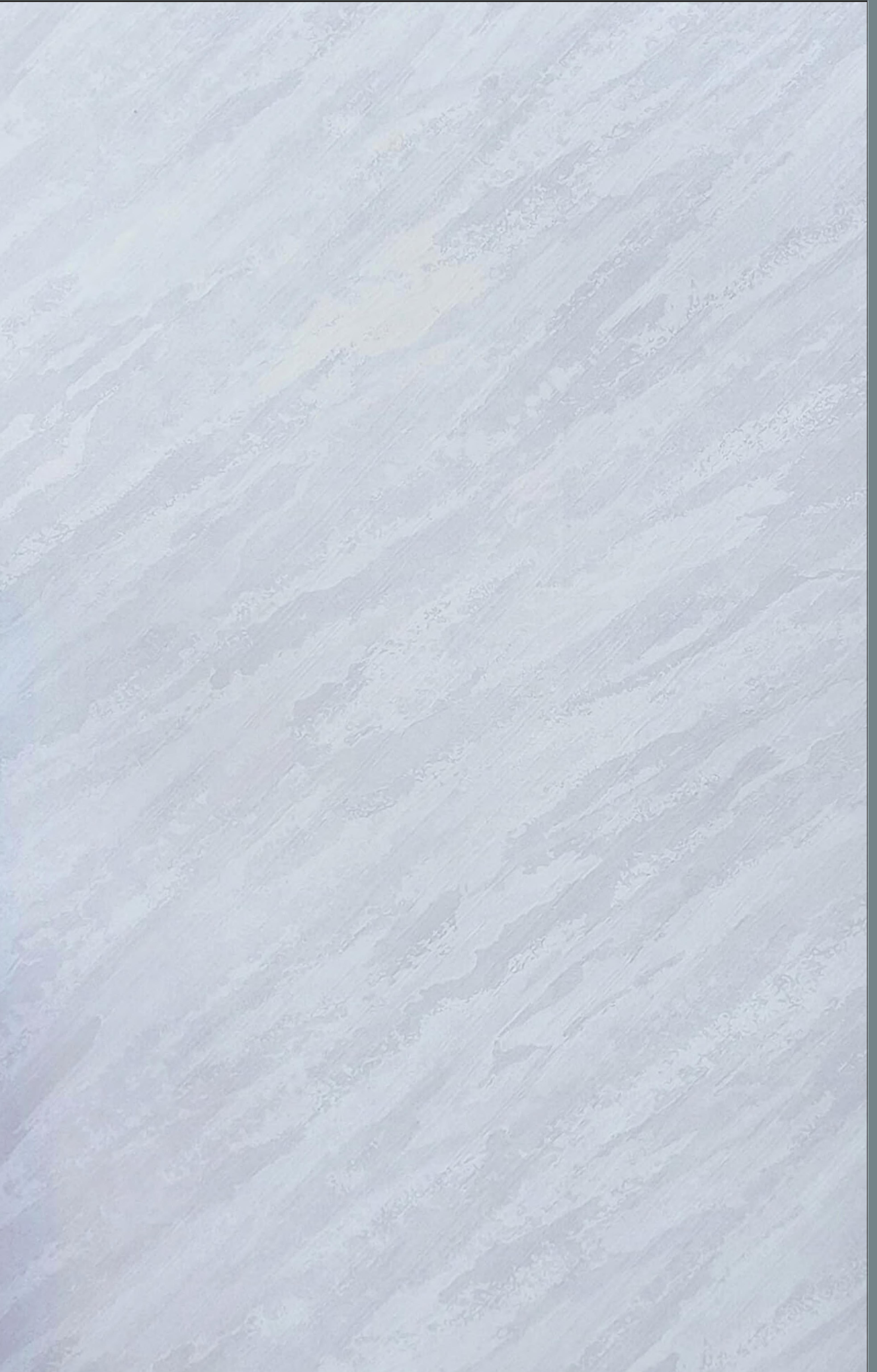 White glossy marble laminate with diagonal streaks and textured surface.