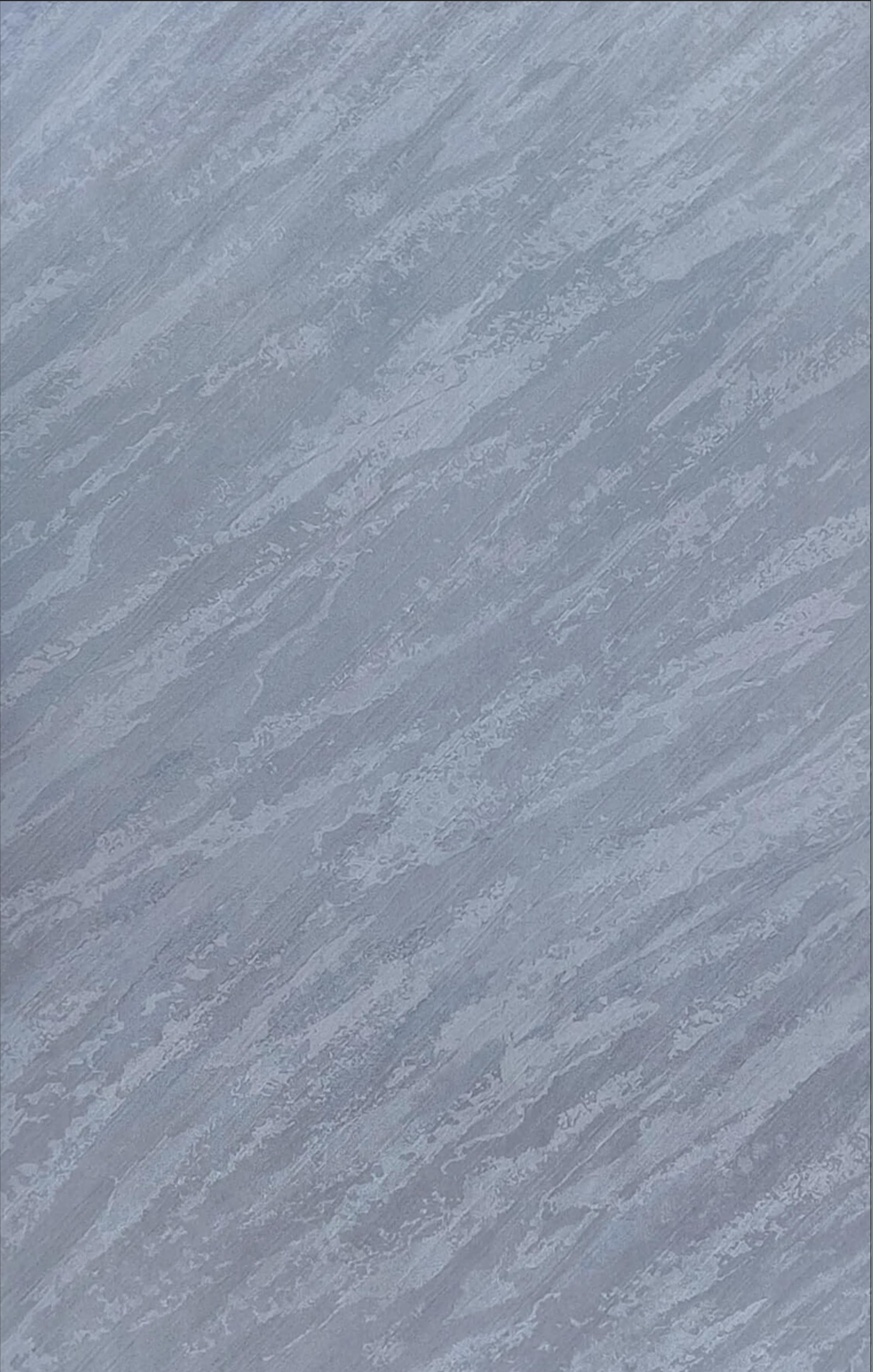 Grey textured laminate with diagonal marble pattern and subtle sheen.
