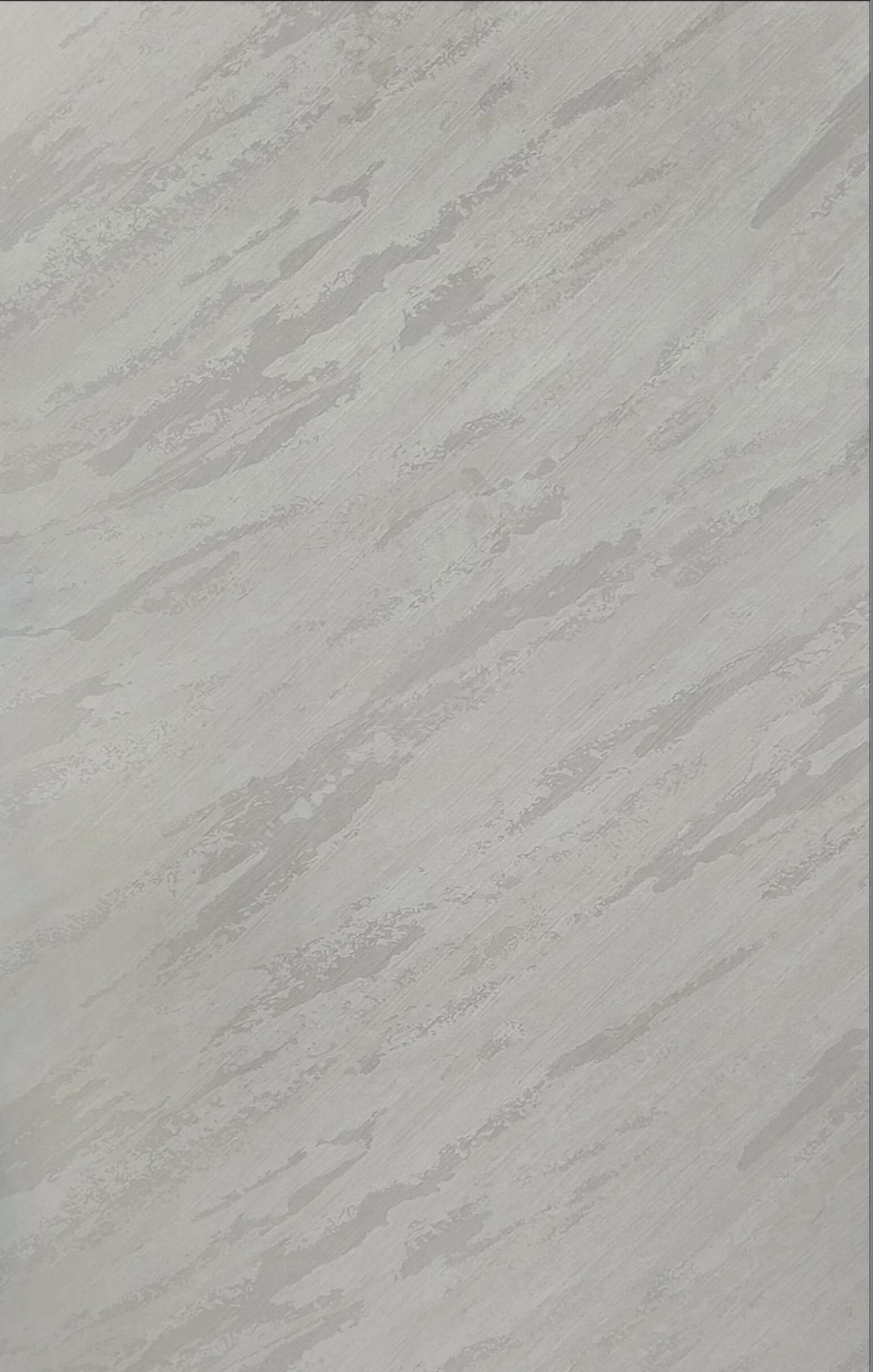 Grey marble laminate with diagonal streaks and matte finish.