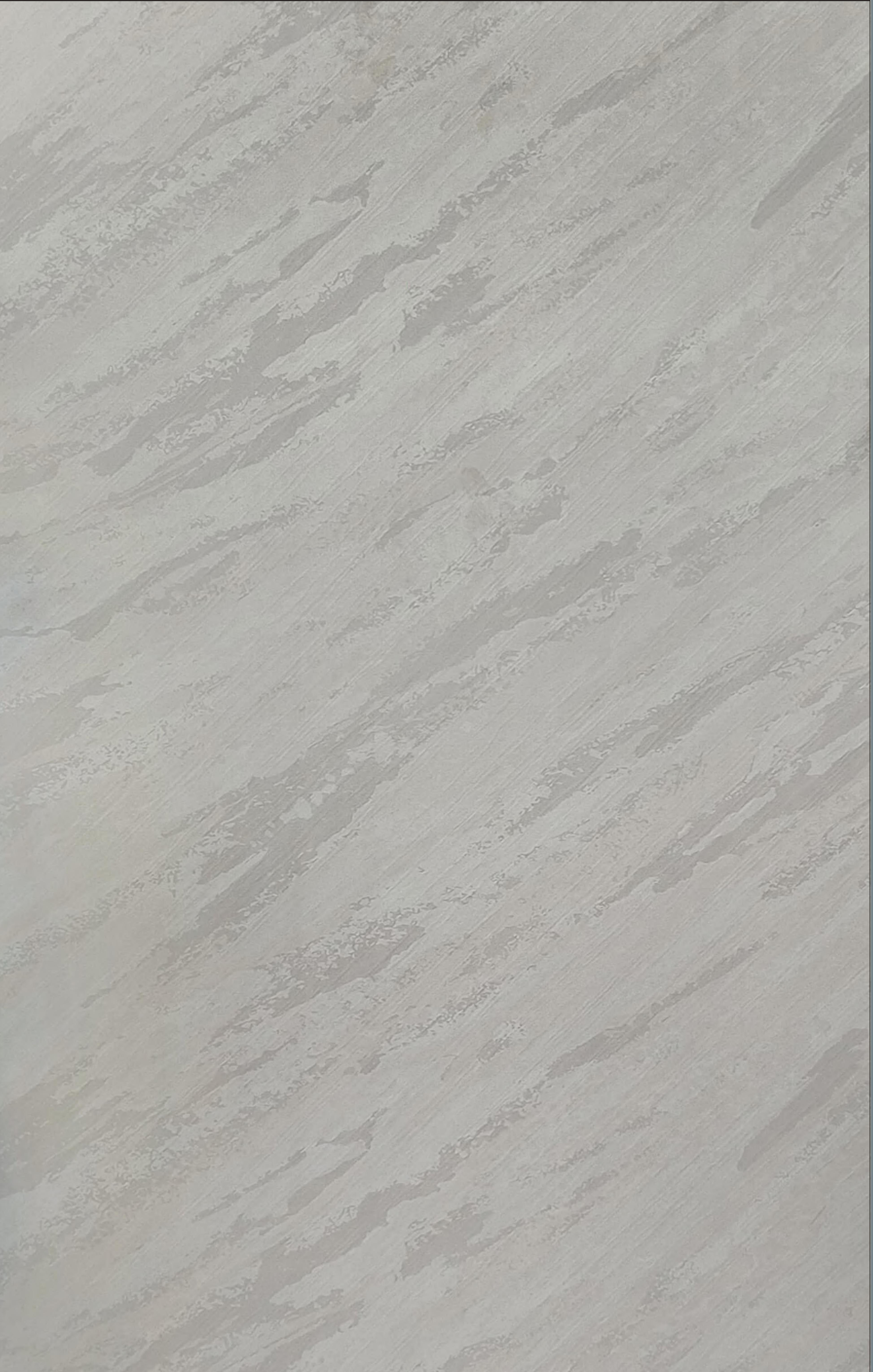 Grey marble laminate with diagonal streaks and matte finish.