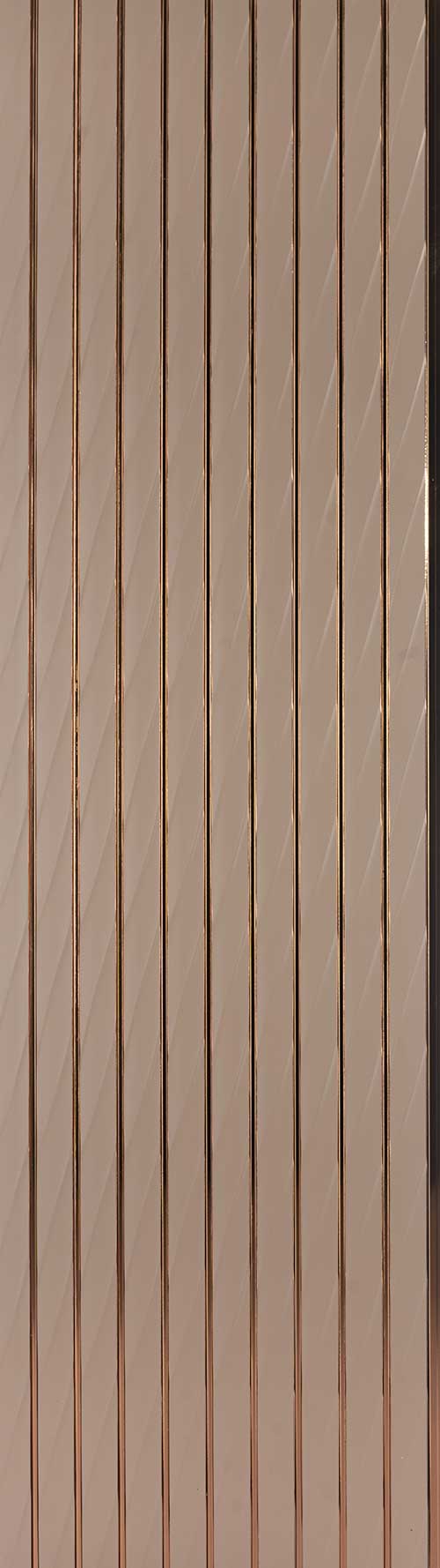 Brown metallic louver panel with matte finish and vertical slats showing subtle sheen and diagonal light reflection