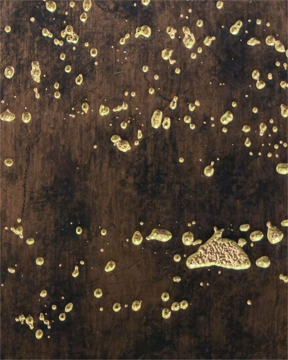 Brown textured designer wall panel with golden speckles and dots, showcasing a unique pattern and texture finish.