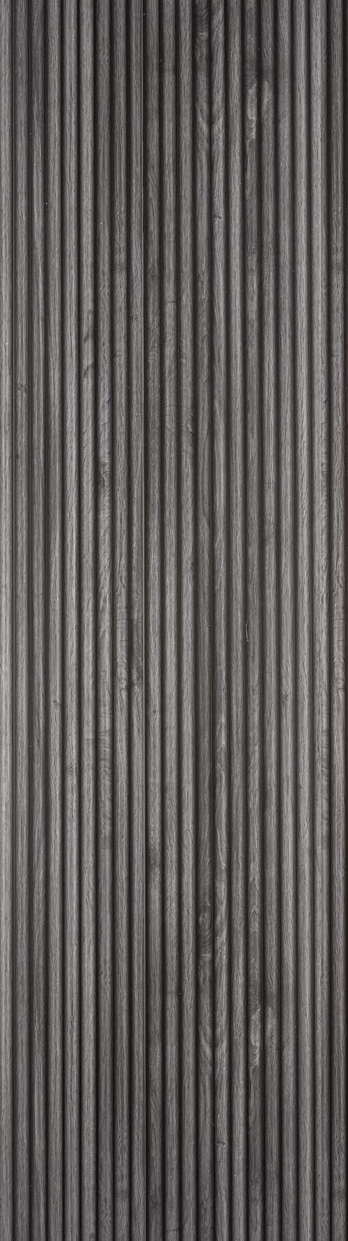 Grey fluted wall panel with matte finish and wood grain texture, showing vertical ridges and subtle grain pattern.