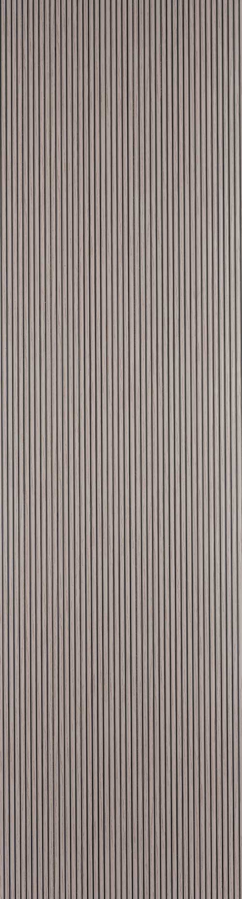 Beige fluted wall panel with matte finish and vertical grooves, showing a textured surface with subtle sheen variation.
