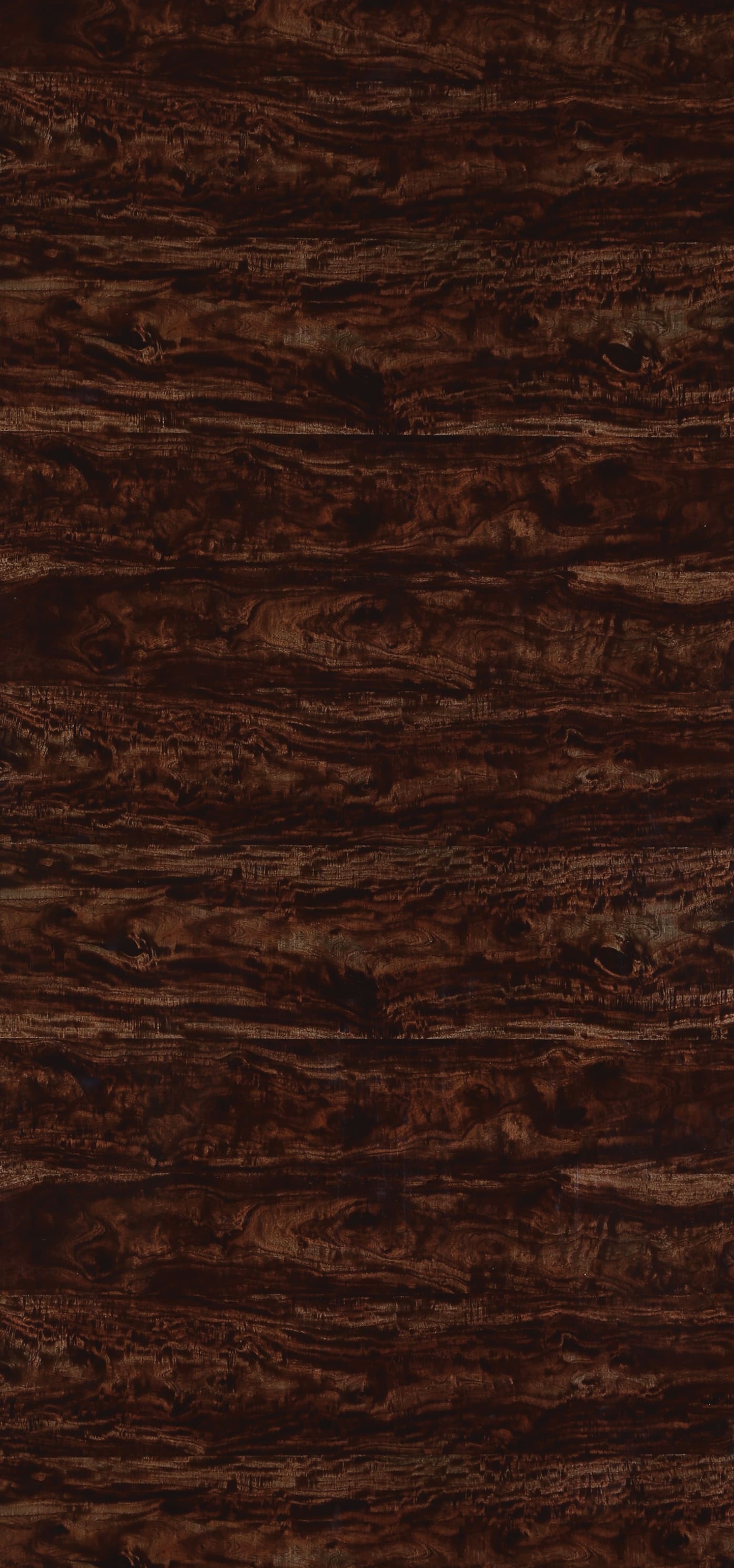 Brown wood grain laminate wall panel with high gloss finish and textured surface.