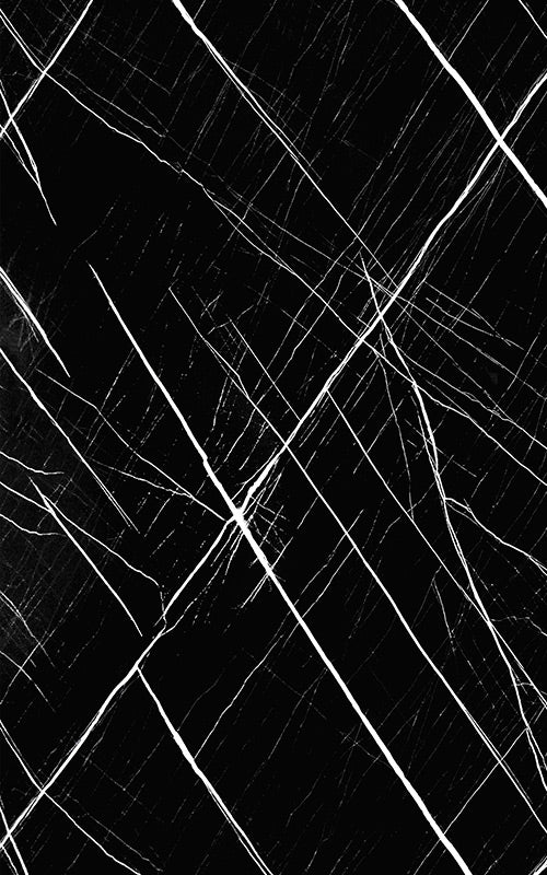 Black marble laminate with white veining and high gloss finish showing diagonal pattern and reflective sheen.