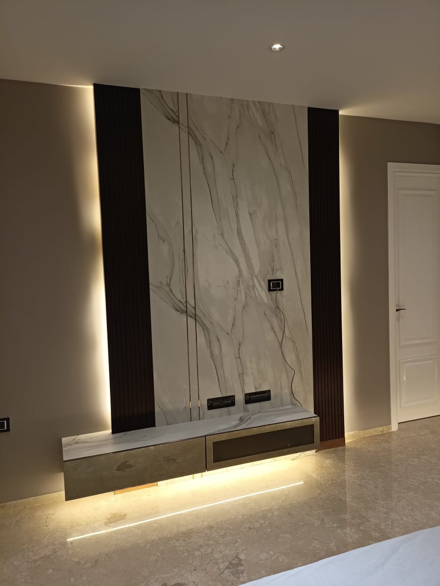 Marble patterned laminate wall with matte finish and dark accents in a modern room setting with ambient lighting