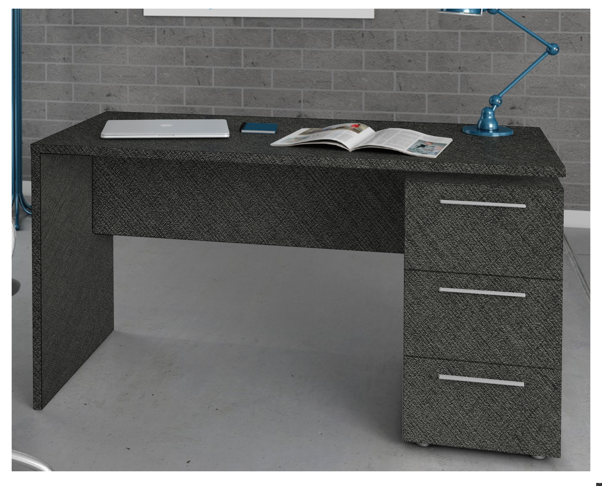 Dark grey textured laminate desk with matte finish and diagonal pattern, used as furniture surface in a modern setting.