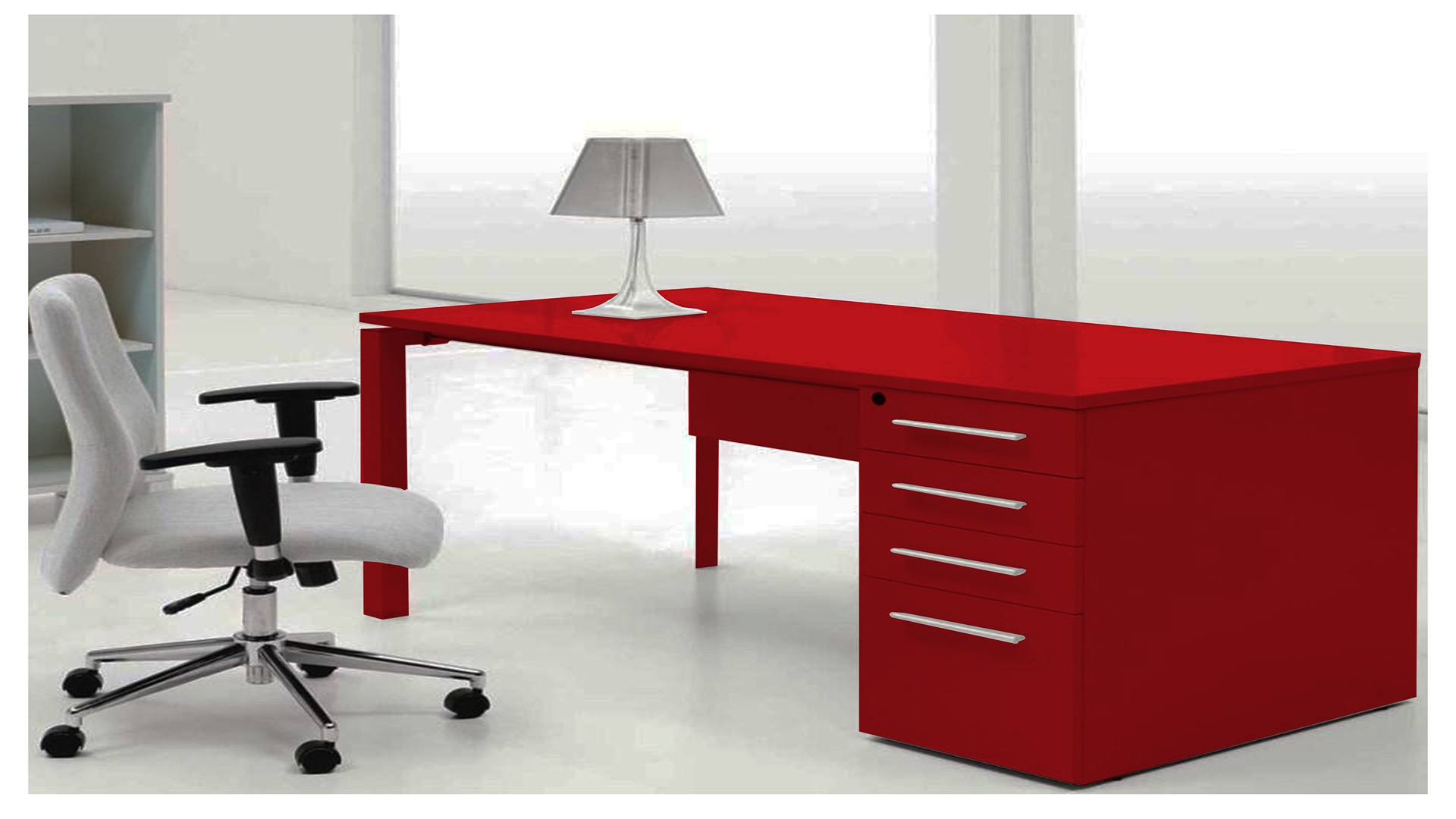 Red matte laminate desk with silver handles in a modern office setting with white chair and lamp