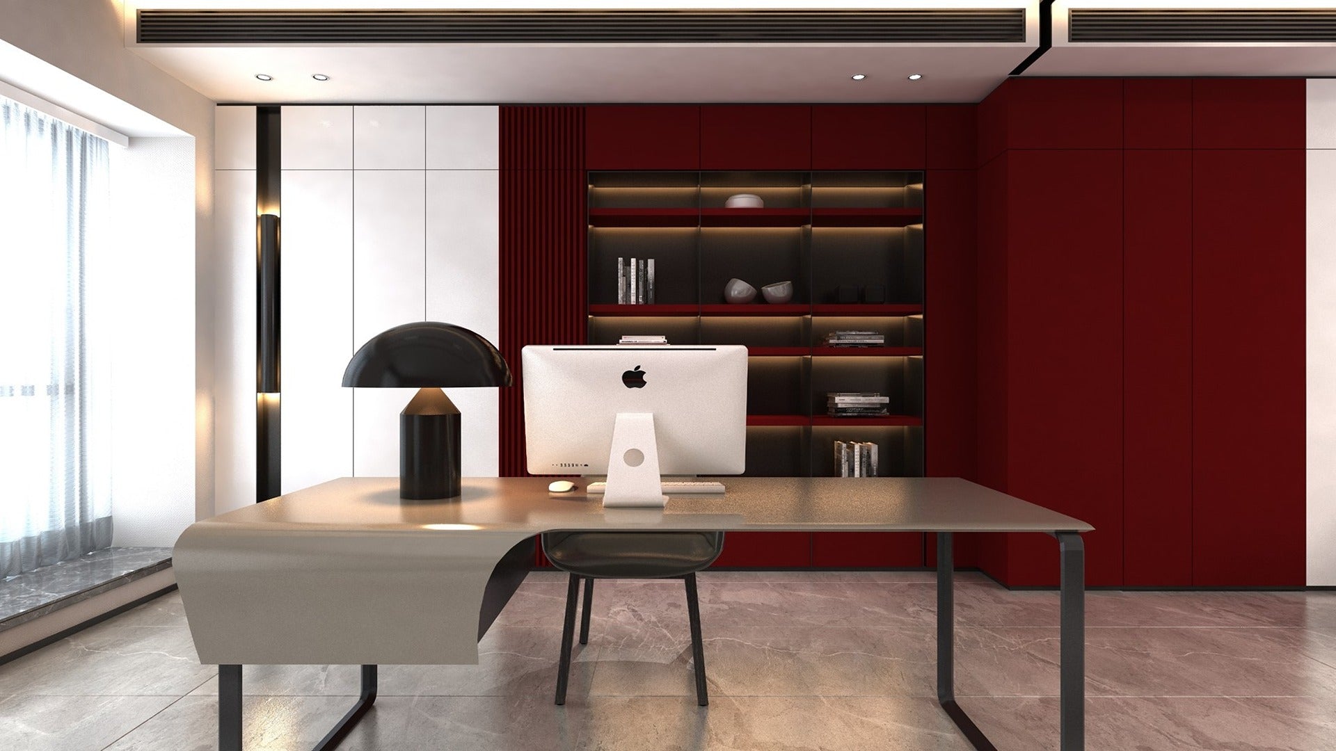 Red matte laminate wall and shelving unit in modern office with desk, computer and lamp.