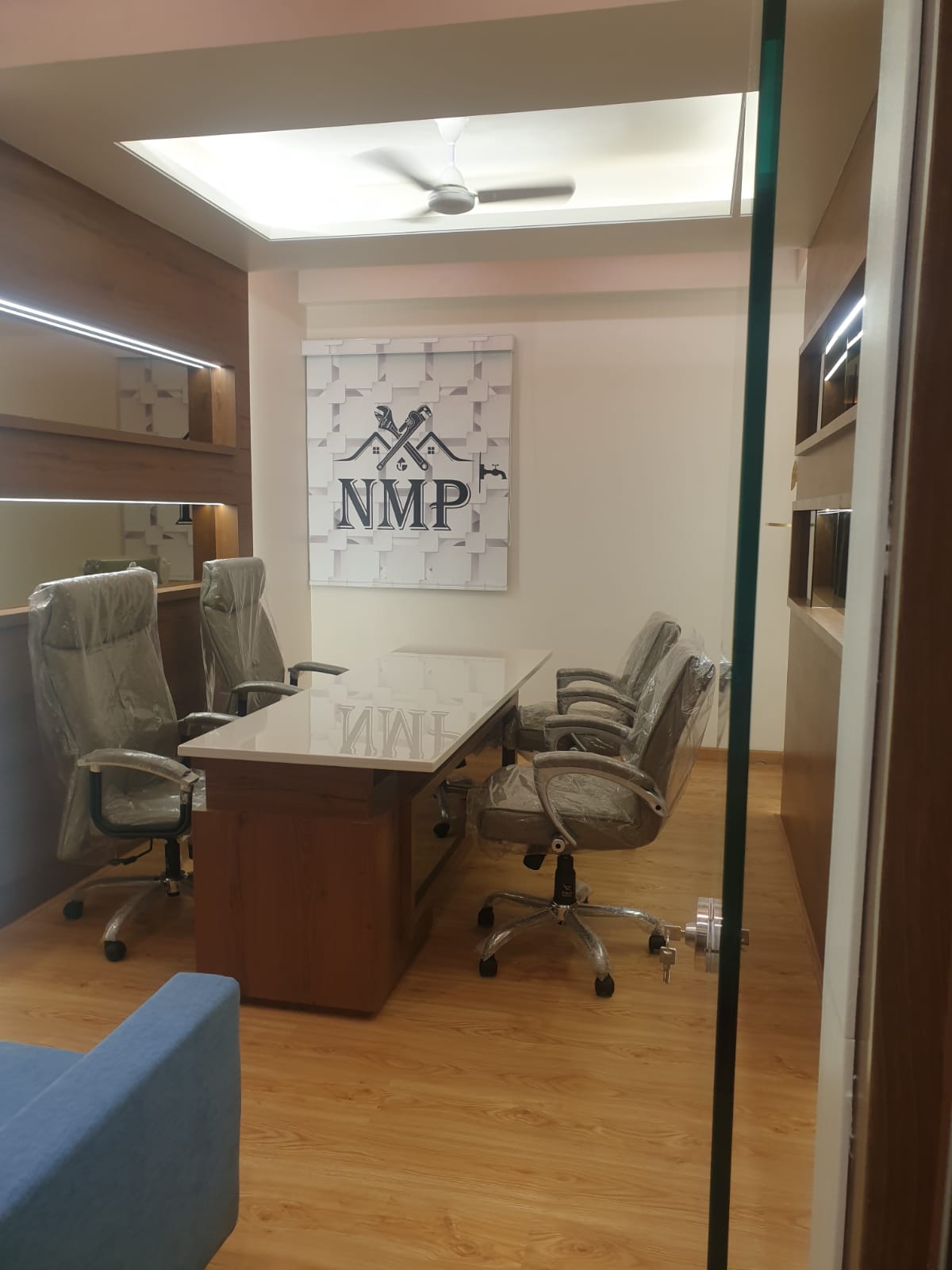 Wood laminate flooring with wood grain texture in office setting, showing durability and aesthetic appeal of decorative