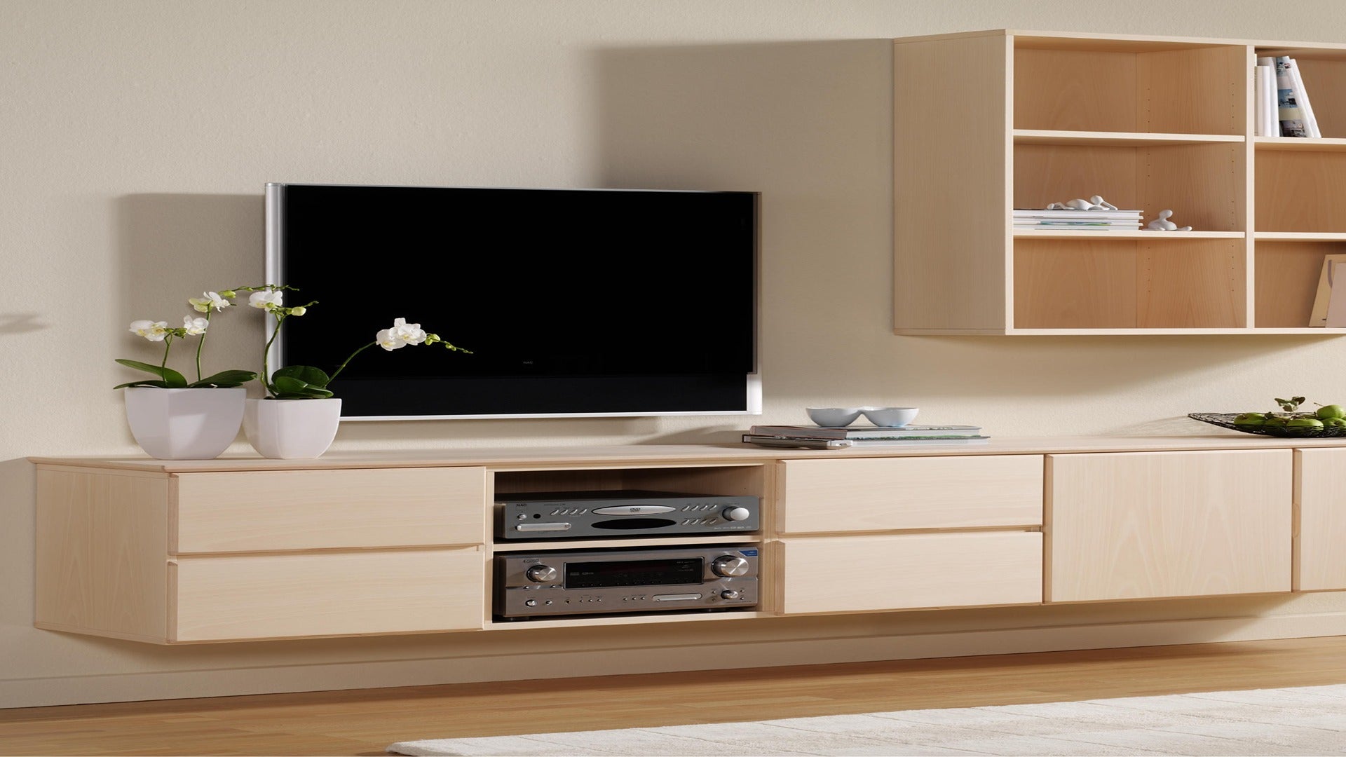 Brown wood grain laminate with matte finish on entertainment unit and shelving unit in a modern living room setting