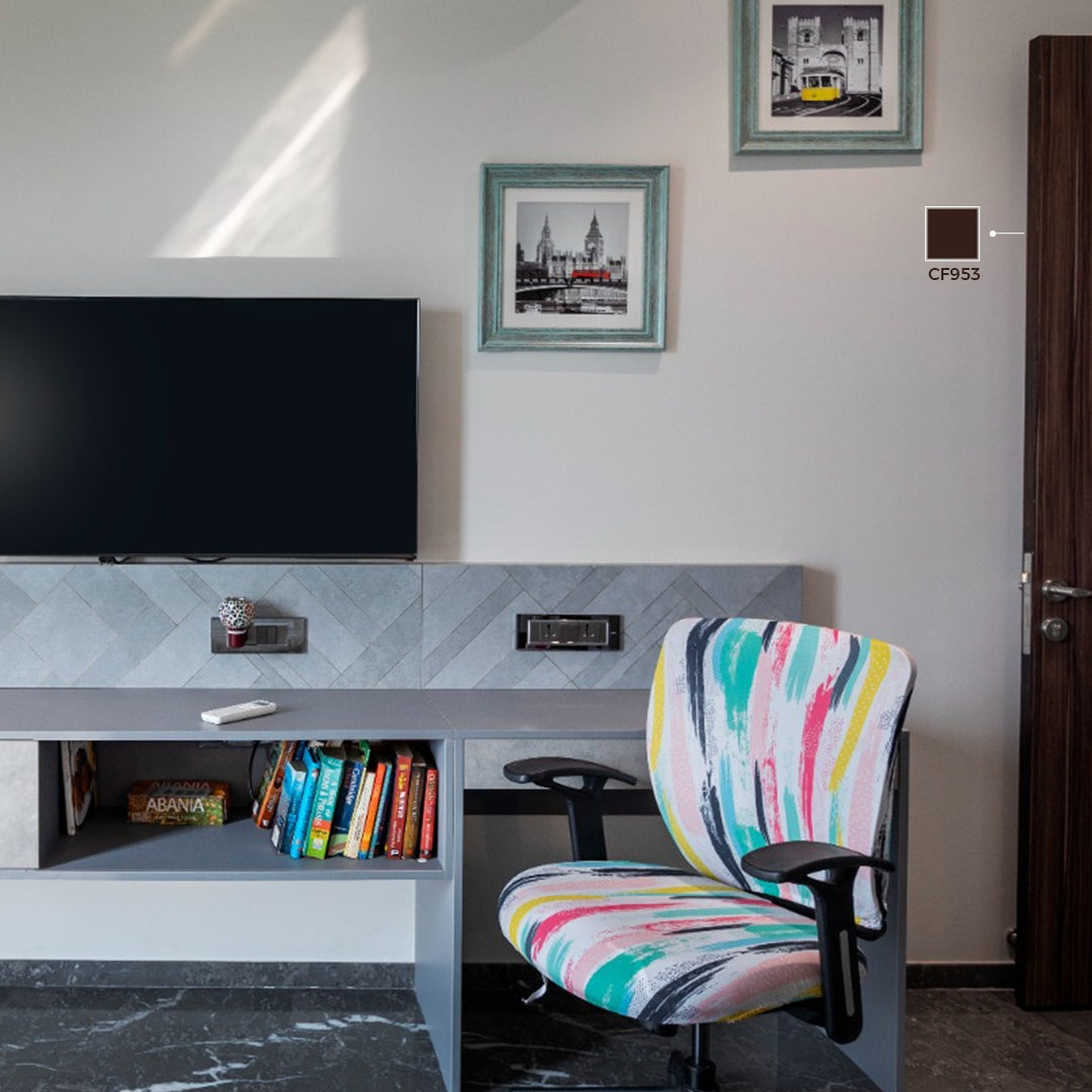 Multicoloured laminate wall with matte finish and wood grain pattern used in modern home office with TV and chair