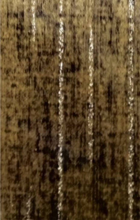 Brown designer laminate with textured finish and vertical wood grain pattern, showing subtle sheen and dark brown accents.