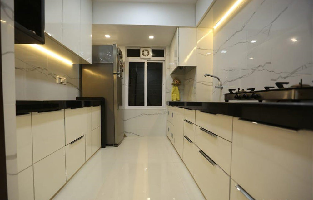 White marble laminate kitchen with sleek black countertops and stainless steel appliances, showcasing high gloss finish and
