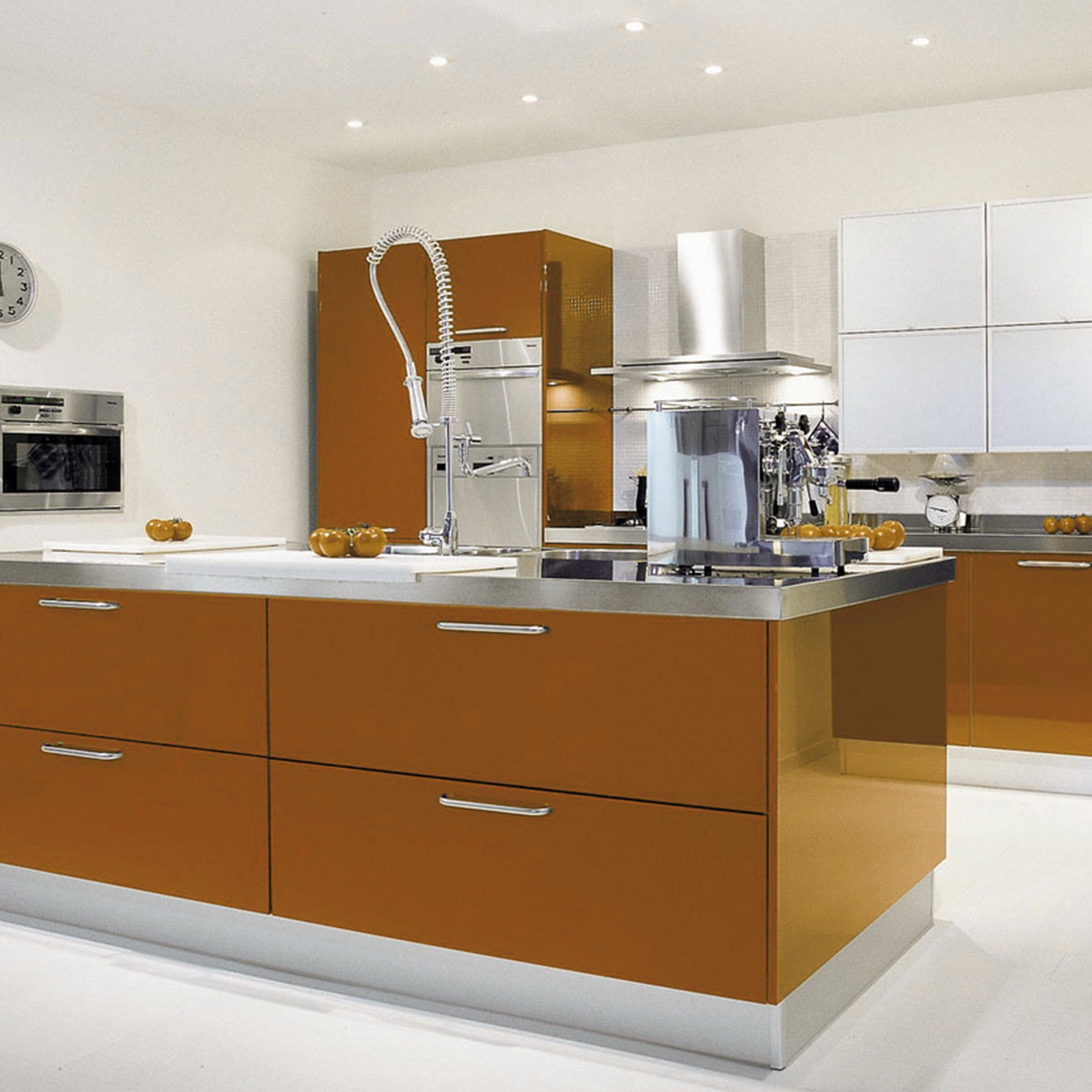 Brown laminate kitchen cabinets with silver handles and stainless steel countertop in modern kitchen interior