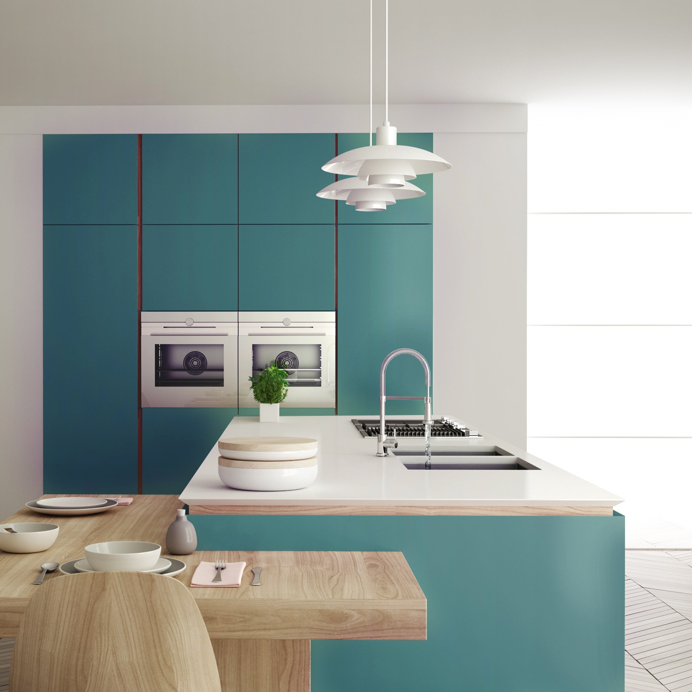 Teal blue glossy laminate kitchen wall with white countertop and pendant lights, showcasing decorative solid color laminate
