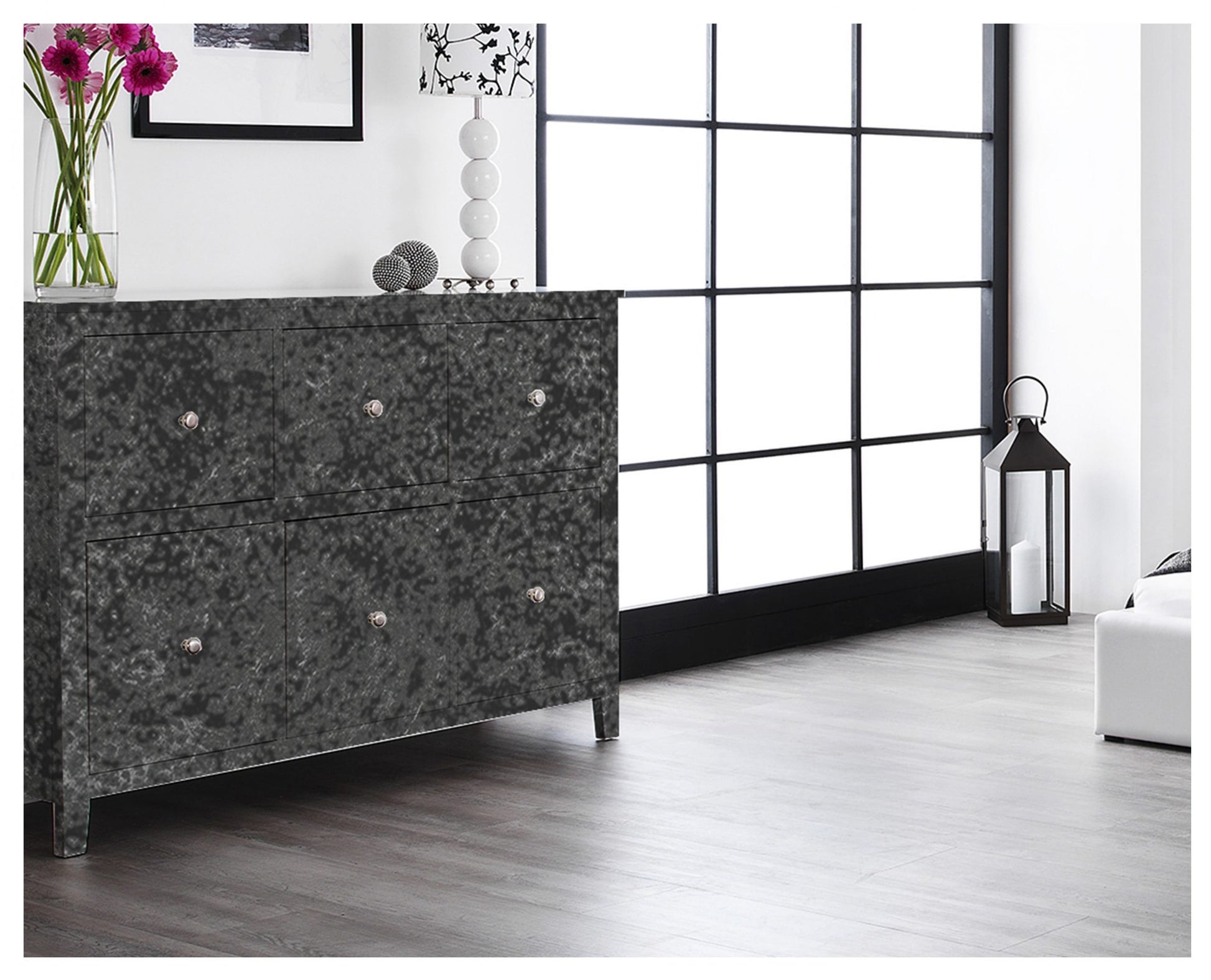 Grey patterned laminate cabinet in modern room with matte finish and textured surface