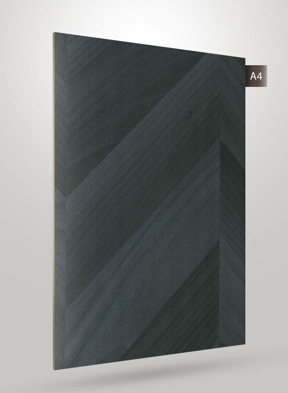 Dark grey patterned laminate sheet with matte finish and diagonal chevron design on grey background.