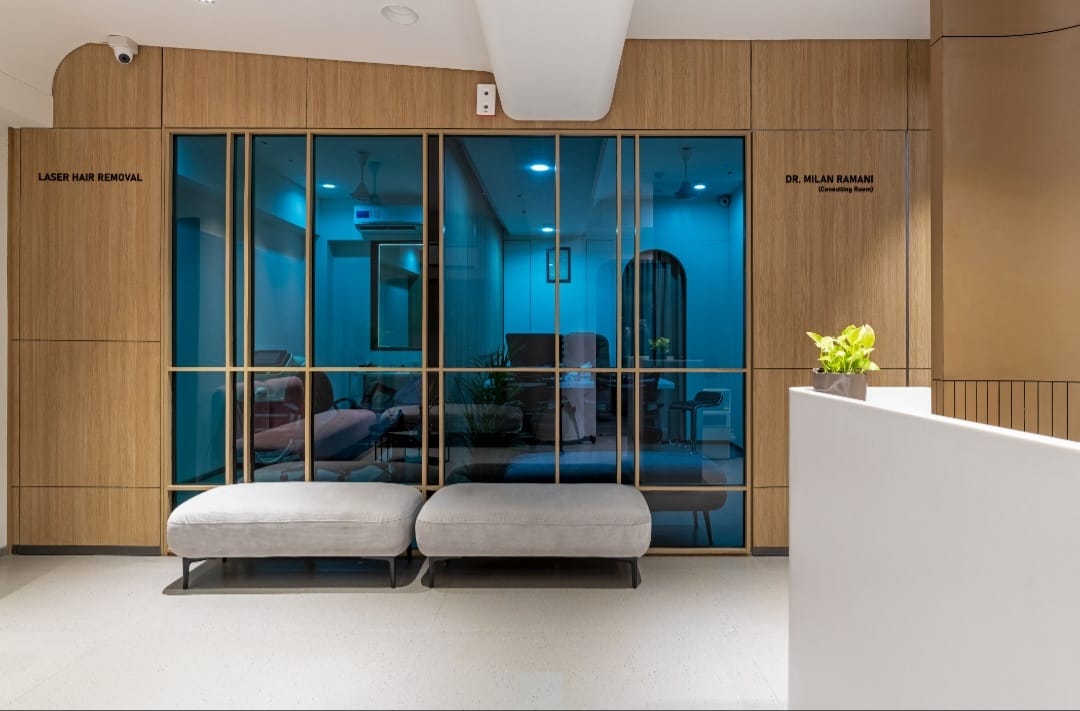 Wood laminate wall panels with matte finish and wood grain texture in a modern interior design setting with glass doors
