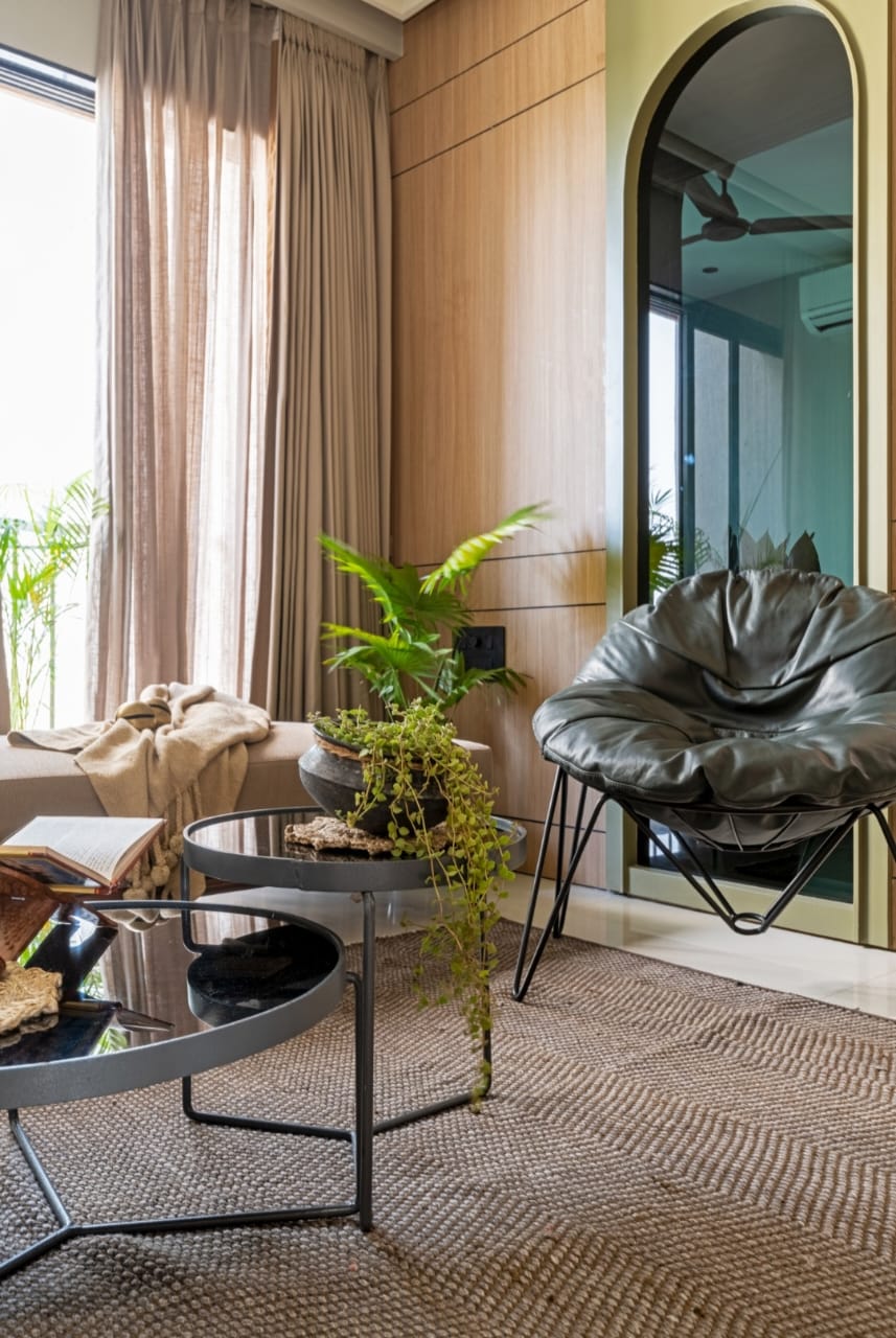 Wood laminate wall with matte finish and wood grain texture in a modern living room setting with furniture and plants
