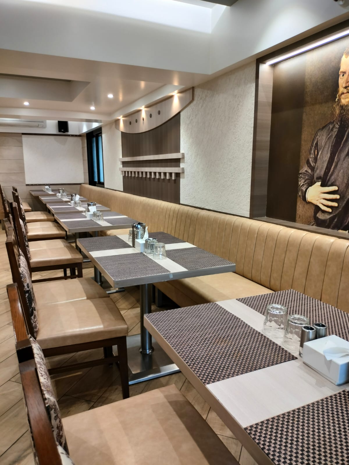 Grey wood laminate table runners with matte finish and wood grain texture in a restaurant setting with booth seating