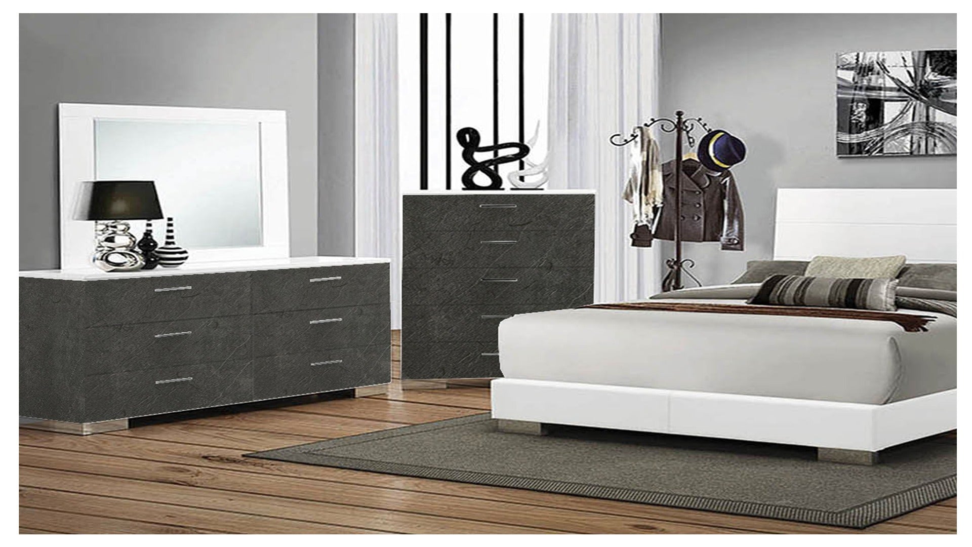 Dark grey marble laminate dresser and chest in modern bedroom with white furniture and minimalist decor.