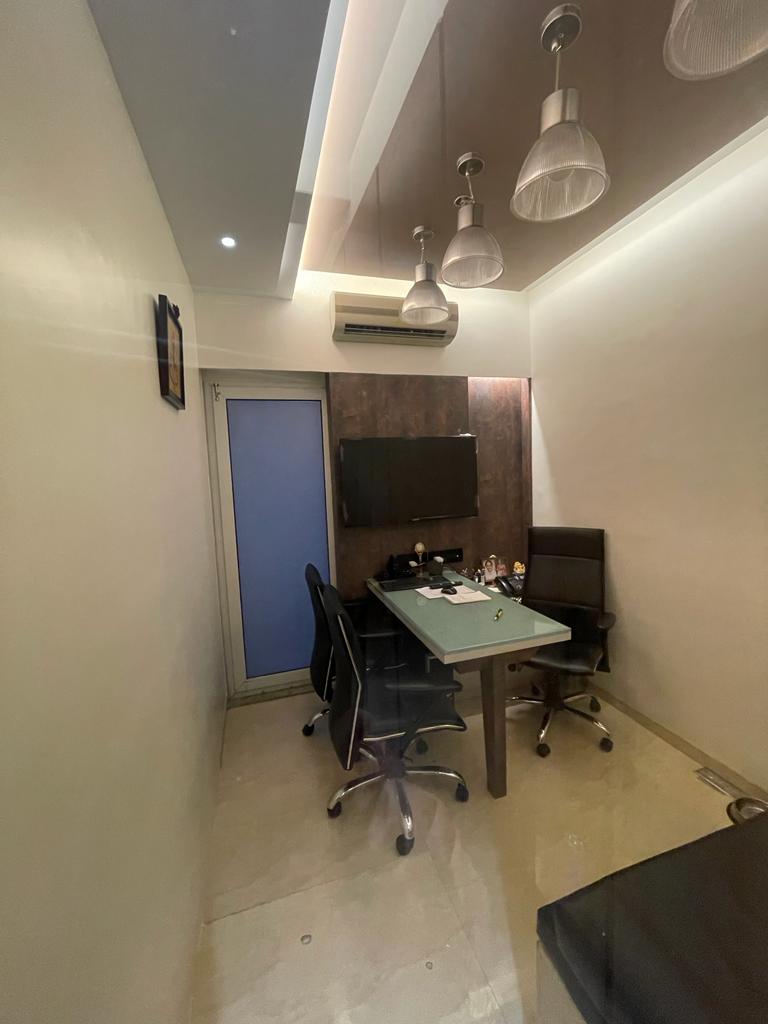 Brown marble laminate wall with matte finish in a modern office setting, showing veining pattern and subtle texture
