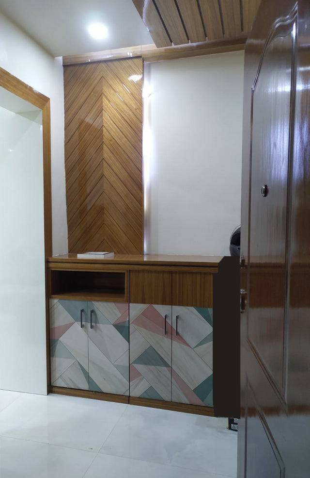 Multi-coloured geometric patterned laminate on cabinet doors with matte finish, used in modern interior design with wooden